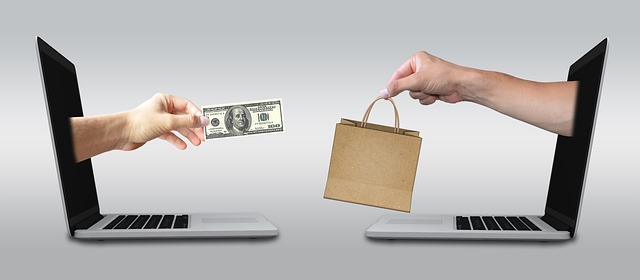 customer reviewing laptop purchase financing options in london computer store